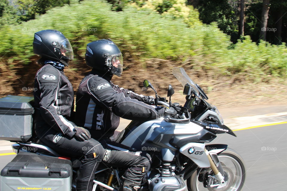 couple riding a motorbike