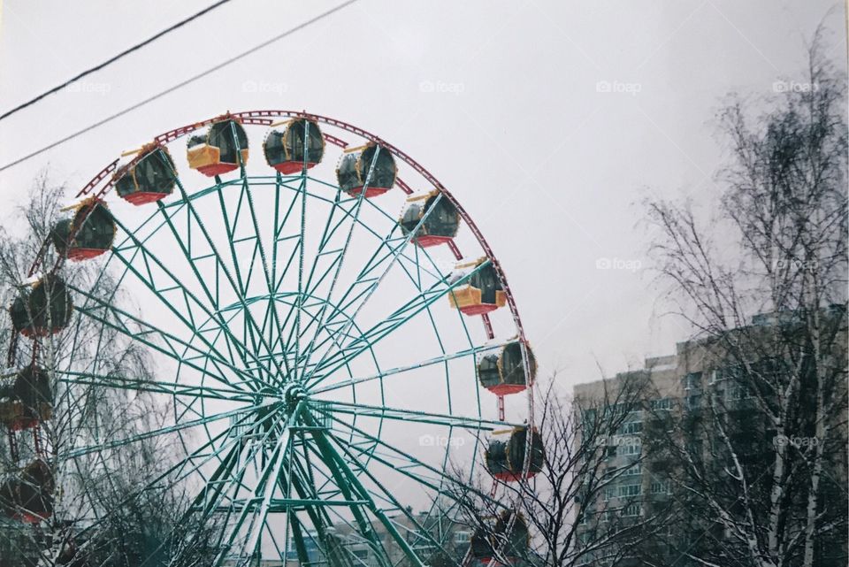 A nice wheel I found in a park nearby. That was a perfect shot to take, with the gray sky and some old Soviet buildings in the background.