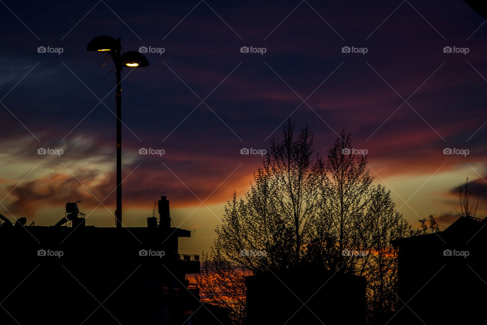 Orange sky and dark street