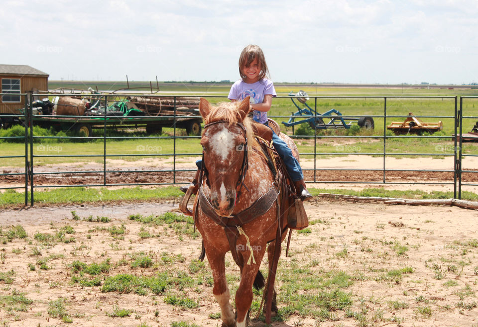 Girl riding horseback