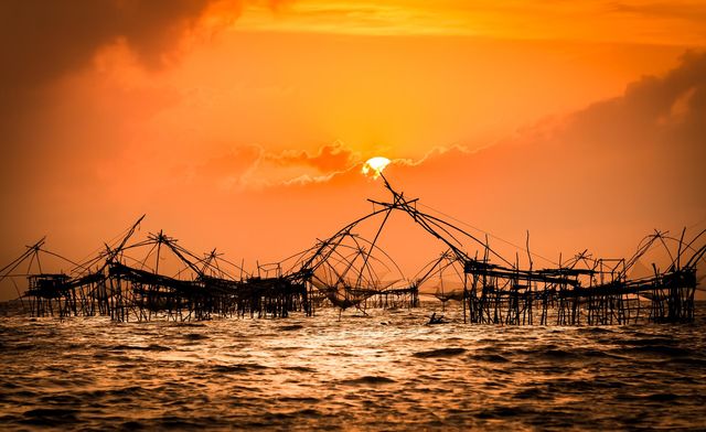 Beautiful sunrise with fishing dip nets in Phatthalung, Thailand amazing spot