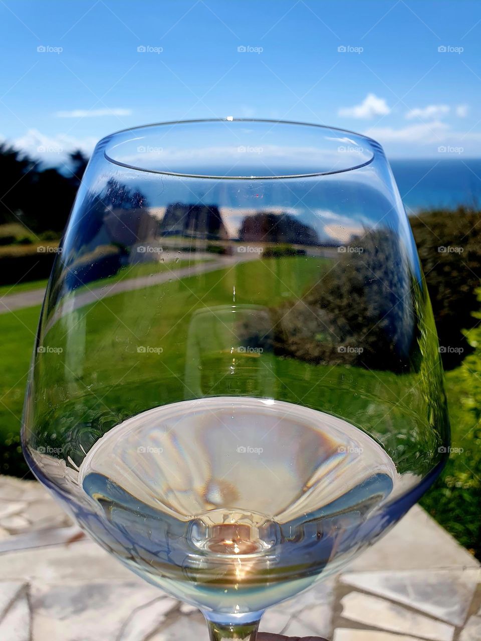 Garden view on Hatainville beach through a glass of Rosé