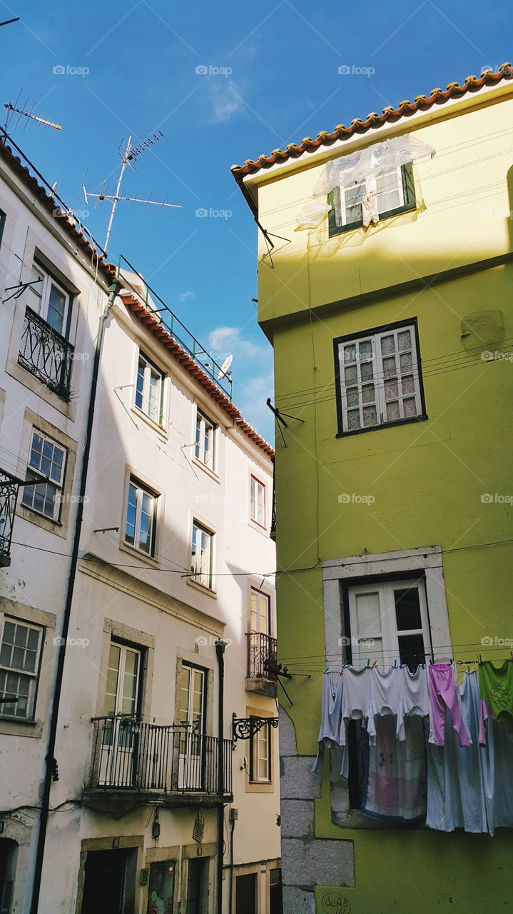 Alfama district street on a sunny day, Lisbon, Portugal
