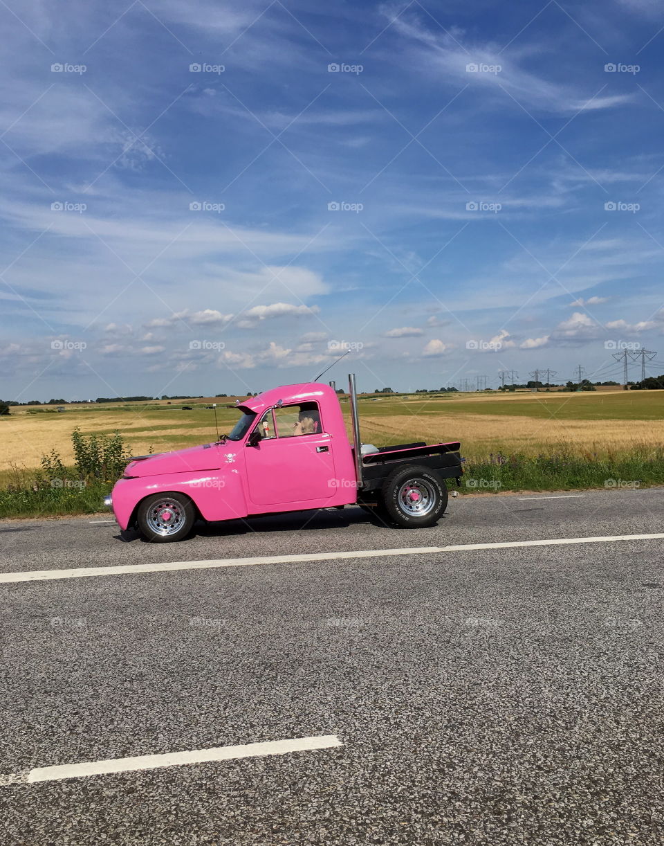 Roadtrip and there goes a pink car.