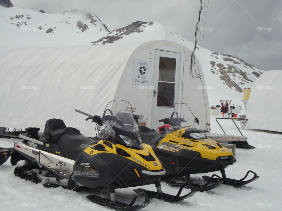 Snowmobiles and Tent