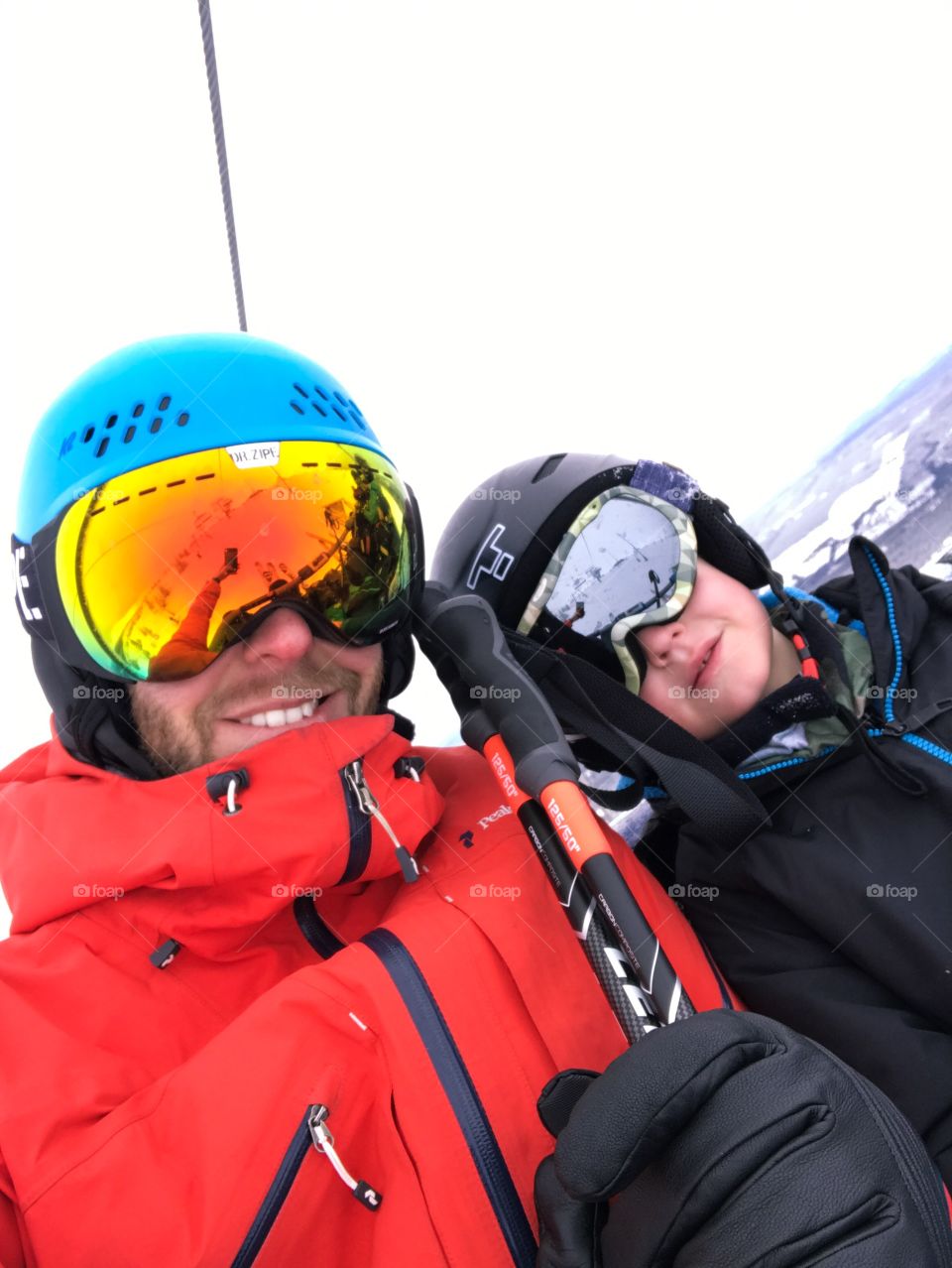 Father and son in the ski lift.