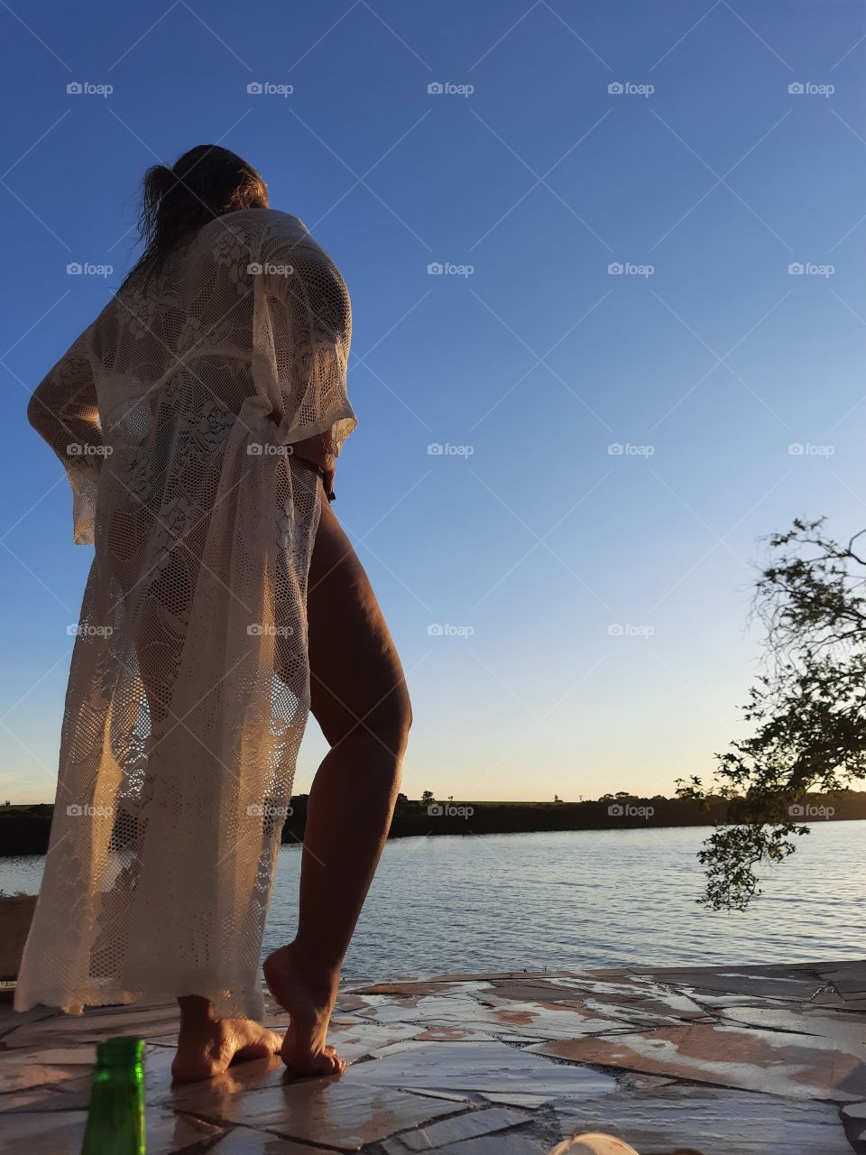 woman in sarong admiring the landscape of nature.