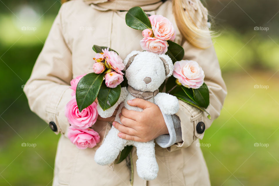 Kid holding hands stuffed teddy bear toy