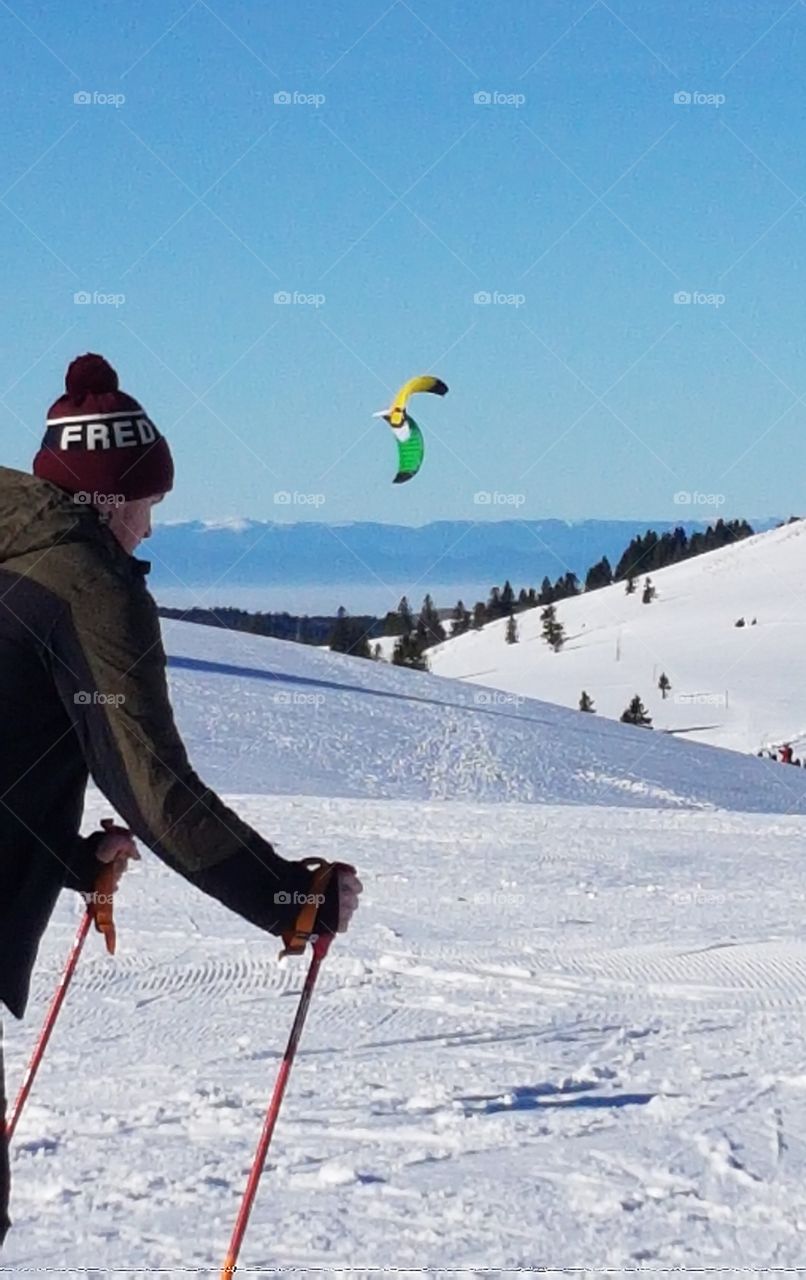 skier with wooly cap in the mountains