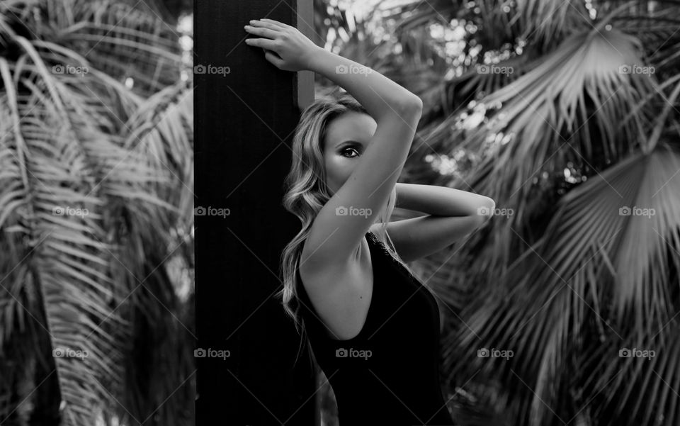 Woman with triangle hands position, beautiful fashion black and white 