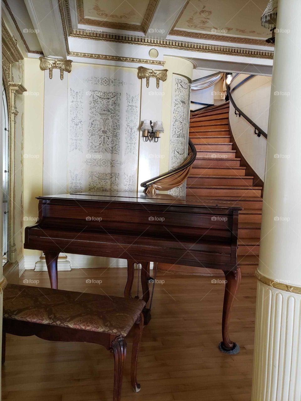 piano at the end of the stairs