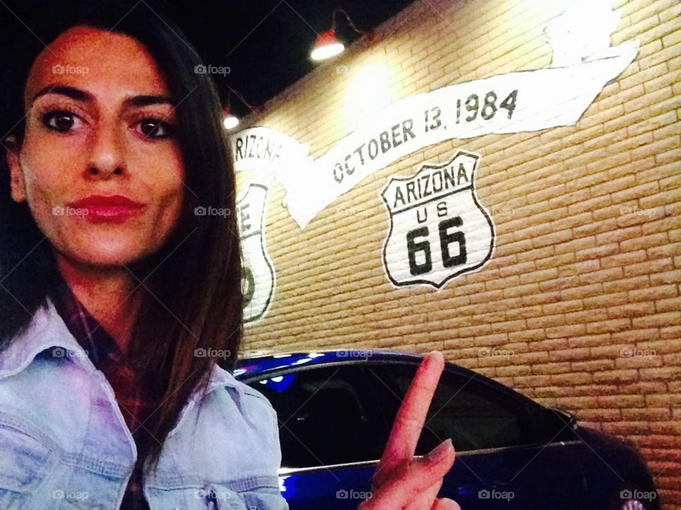 Selfie woman near at a wall on the route 66