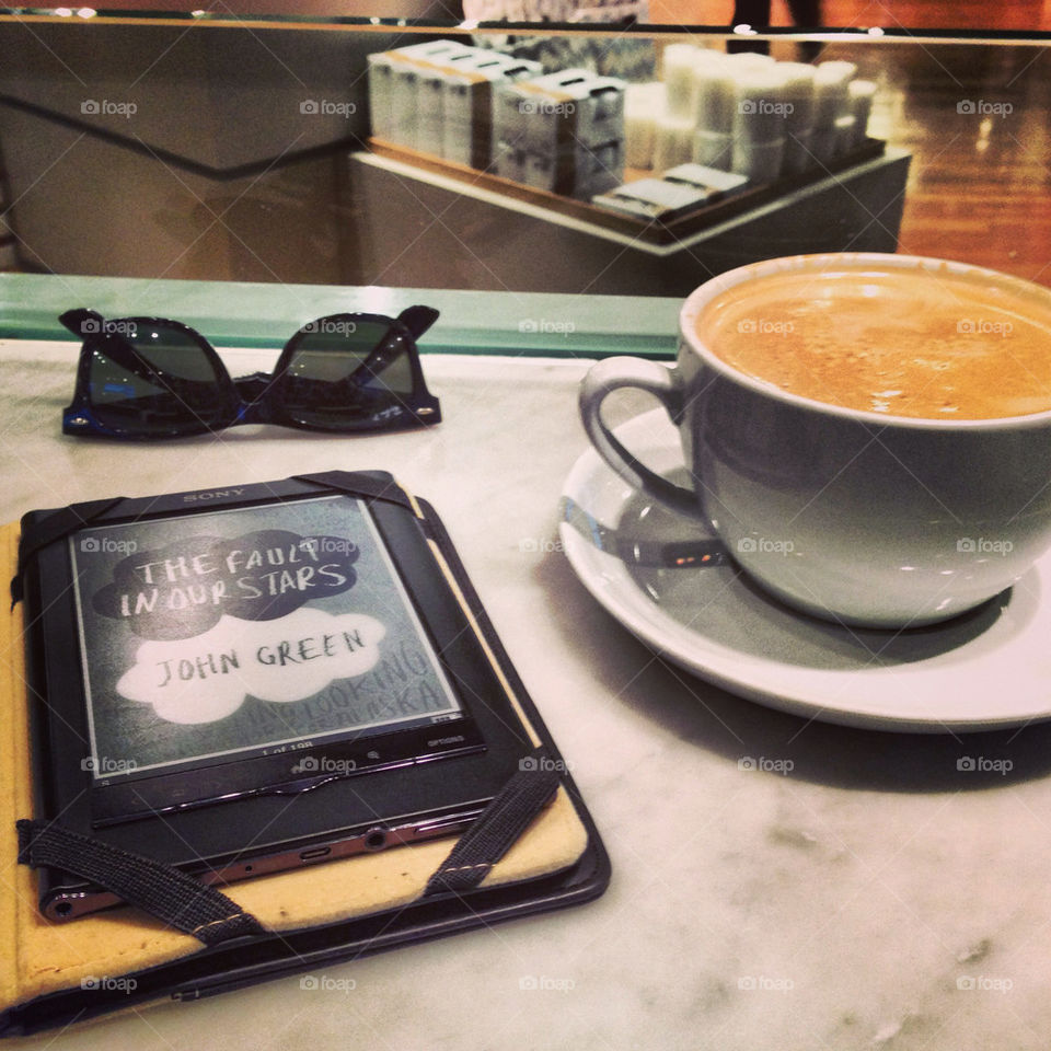 reading and enjoying a cappuccino :)