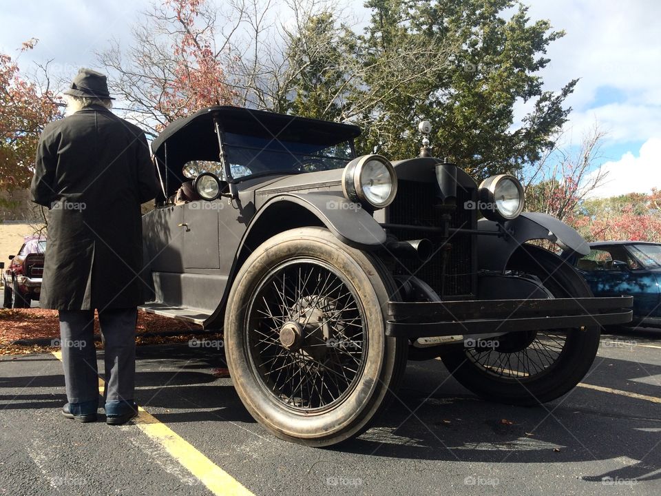 1922 Stanley Steamer. A man in period dress  talks to people about his 1922  Stanley Steamer at a car show in Concord Ma. 