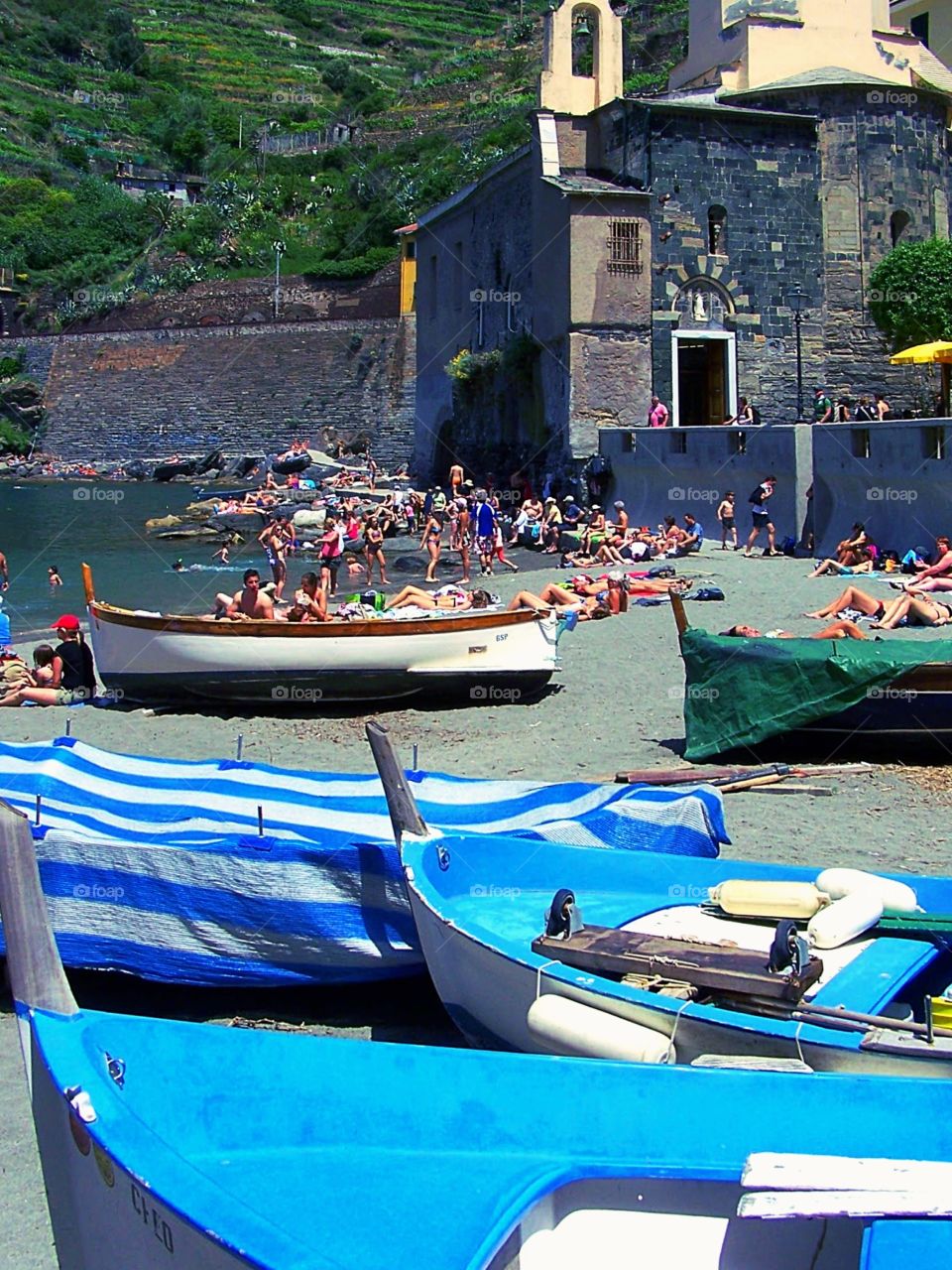 Boats docking in the port of Vernazza, Italy