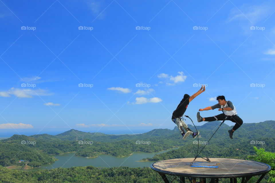 Two people jumping