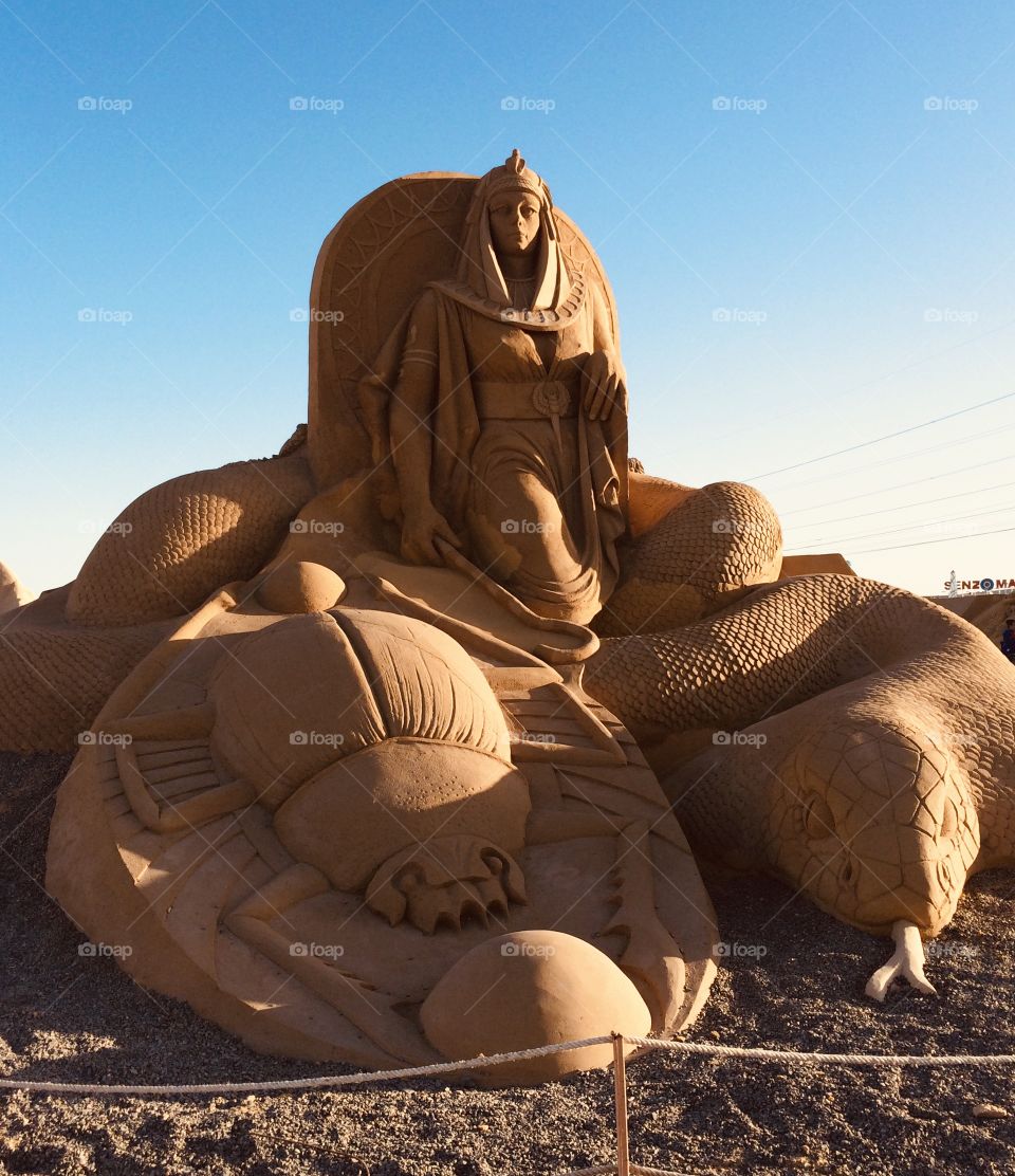 
sand woman with a snake and a scorpion