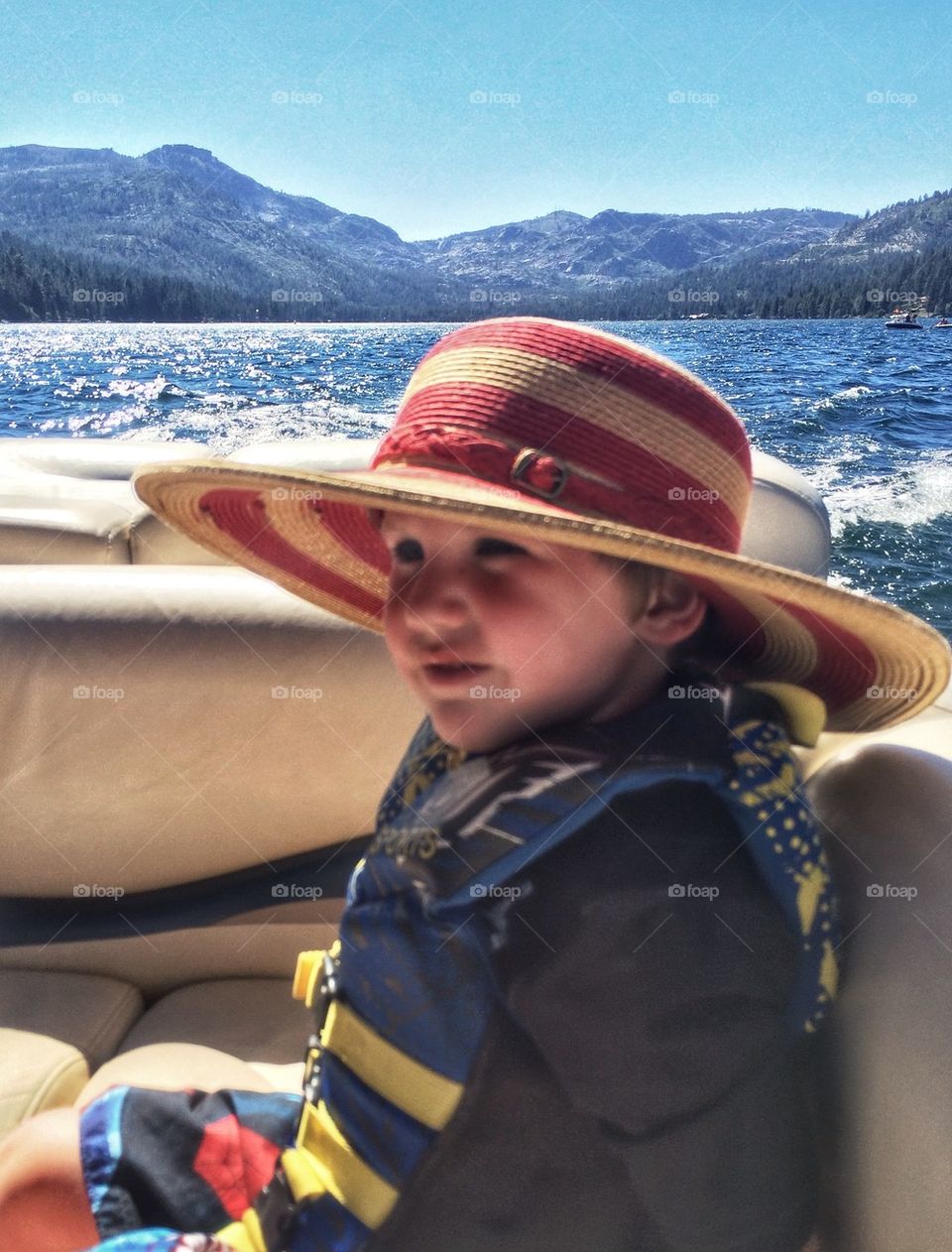Young Boy Wearing A Hat In The Sun
