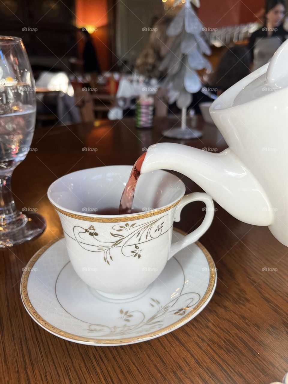 Delicious Pomegranate chocolate flavored tea. Served at a fancy tea party at a castle. 