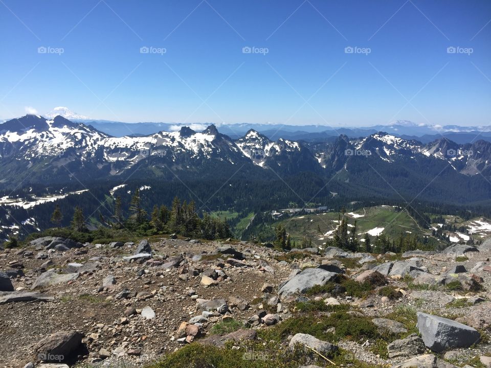 Hiking at Mount Rainier, WA. Mount Saint Helens is the peak in the far back left of the photo.