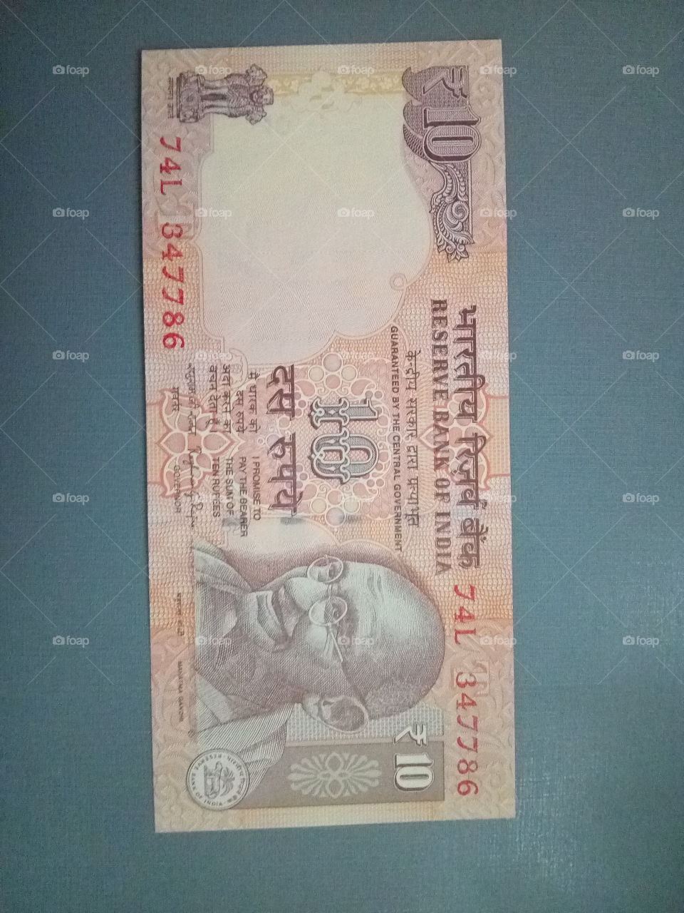 ten rupee Indian currency note with holly number 786