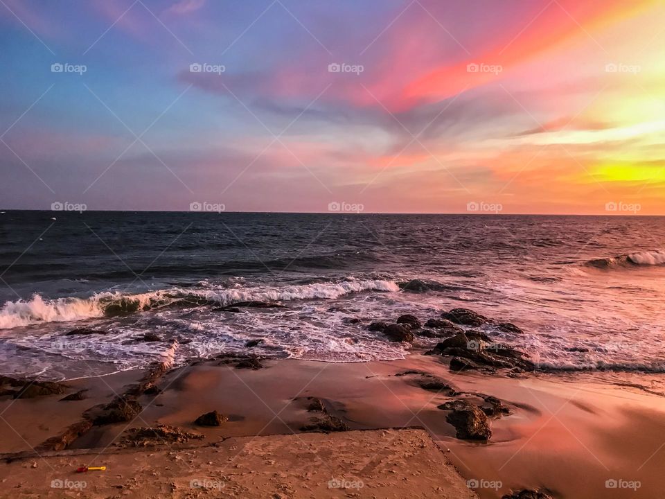 Sunset on the sea , I love looking at the colors of the sunset , I sat at a beachside restaurant and enjoy it.