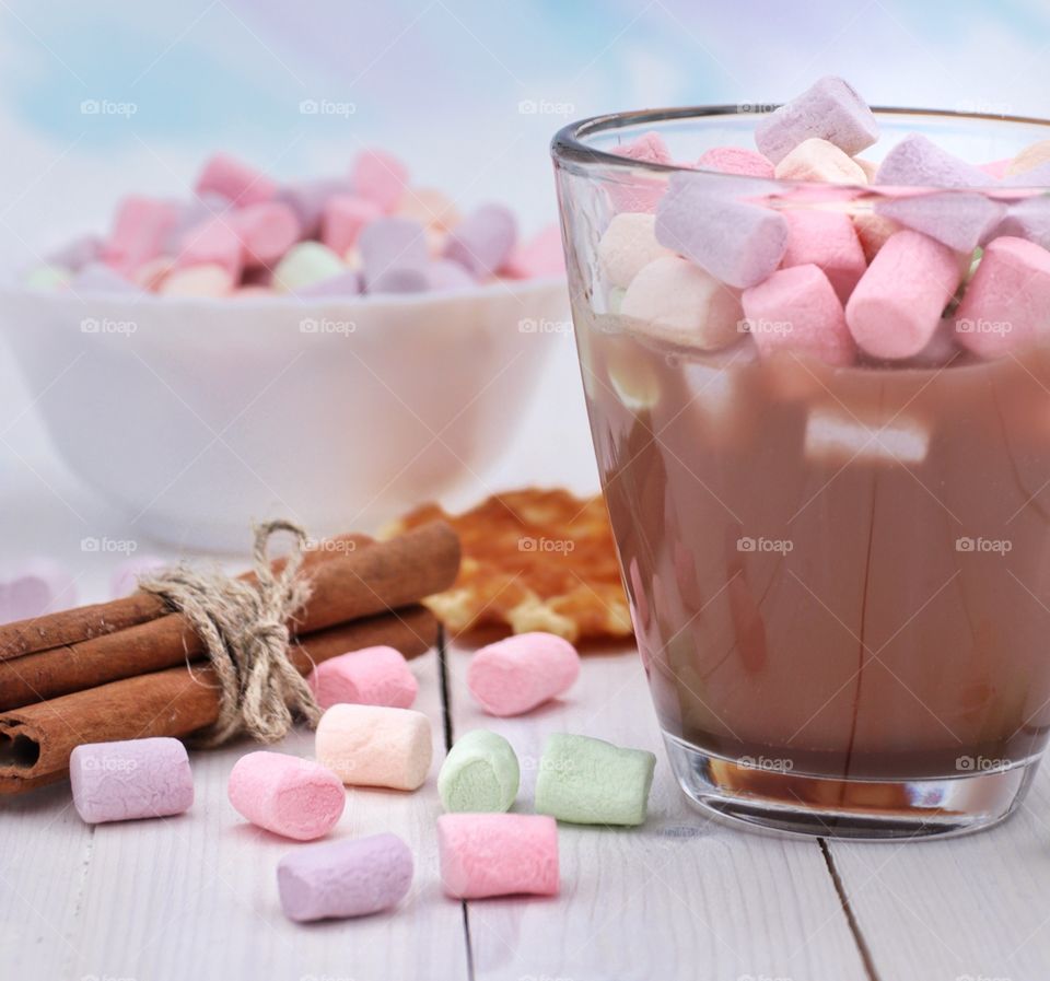 A glass of hot chocolate with marshmallows