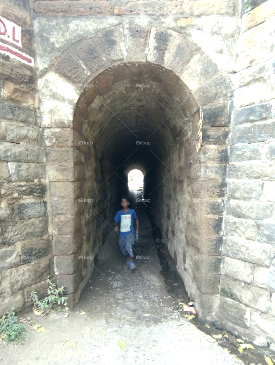 Photo of long tunnel culvert,good photo,a natural photo,a true photo, photo of long culvert,good photo of old long culvert,photo passing through a baby culvert,photo inside a baby culvert,good natural photo,best real photo,indian boy in long tunnel