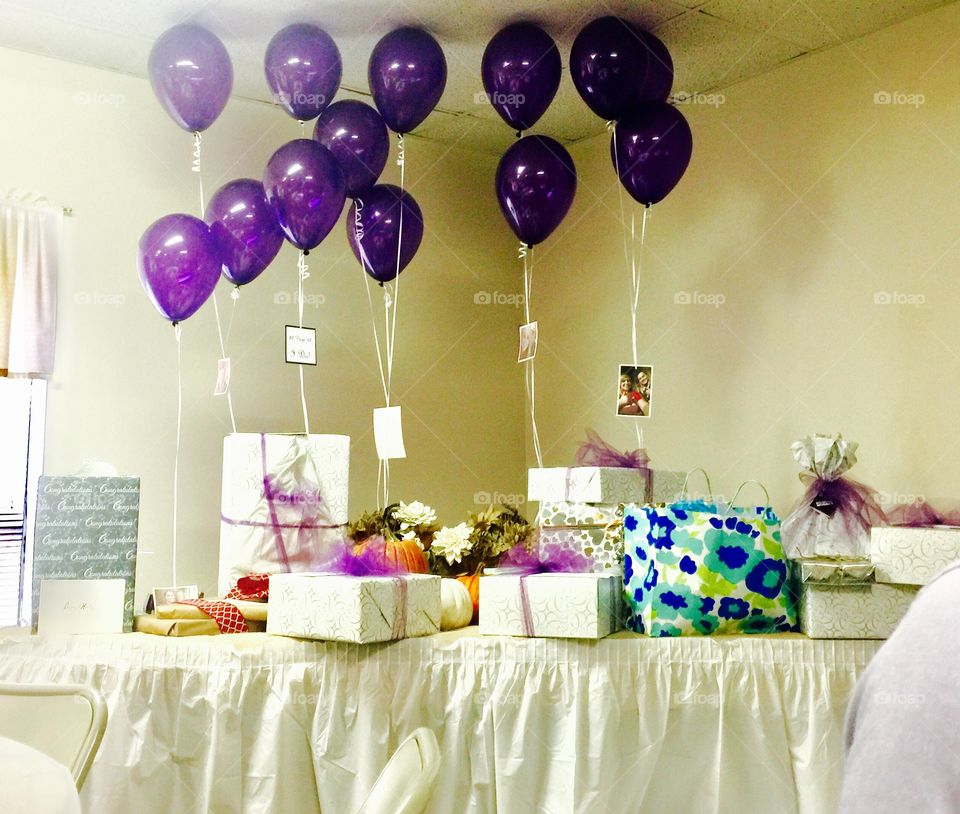 Purple balloons and gifts