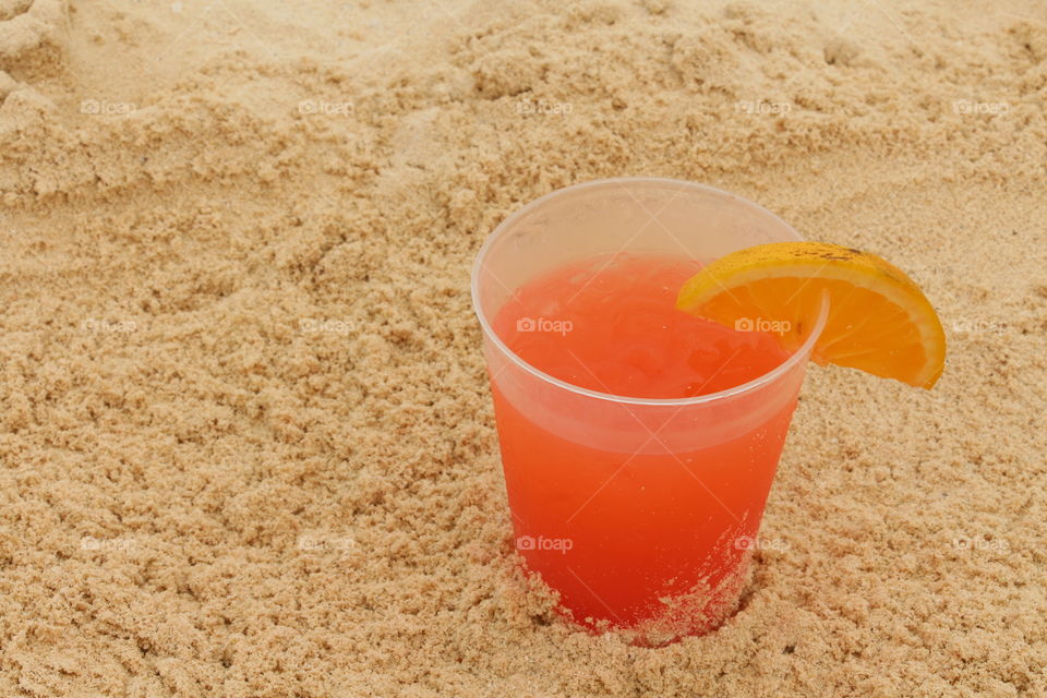 Tequila sunrise under sand