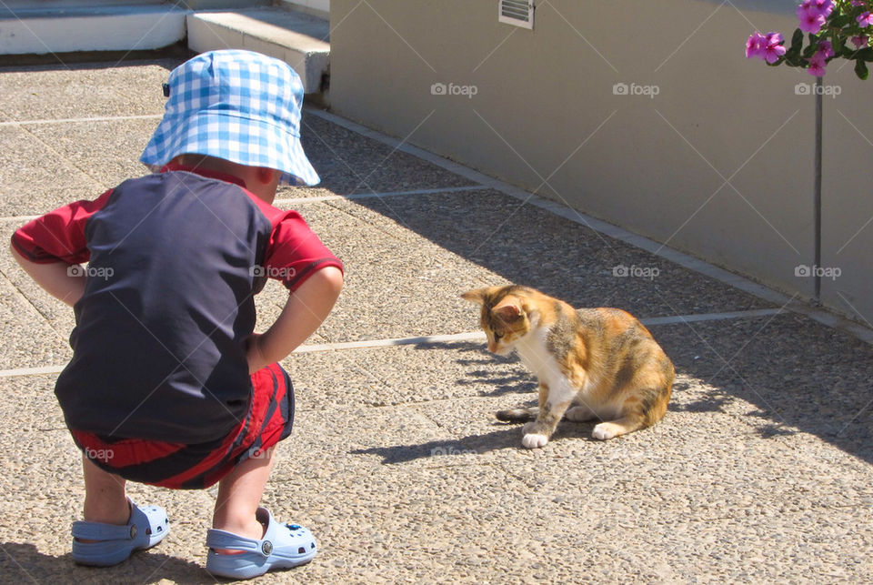 Boy meet a cat.