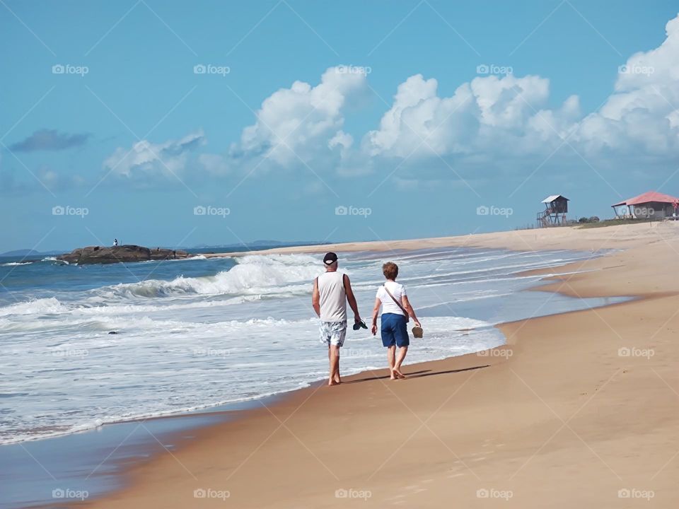 walk peacefully along the golden sands of a deserted beach, with a sea of crystalline waters beside it, where you can only hear the sound of the crashing waves.  A sense of relaxation and peace.