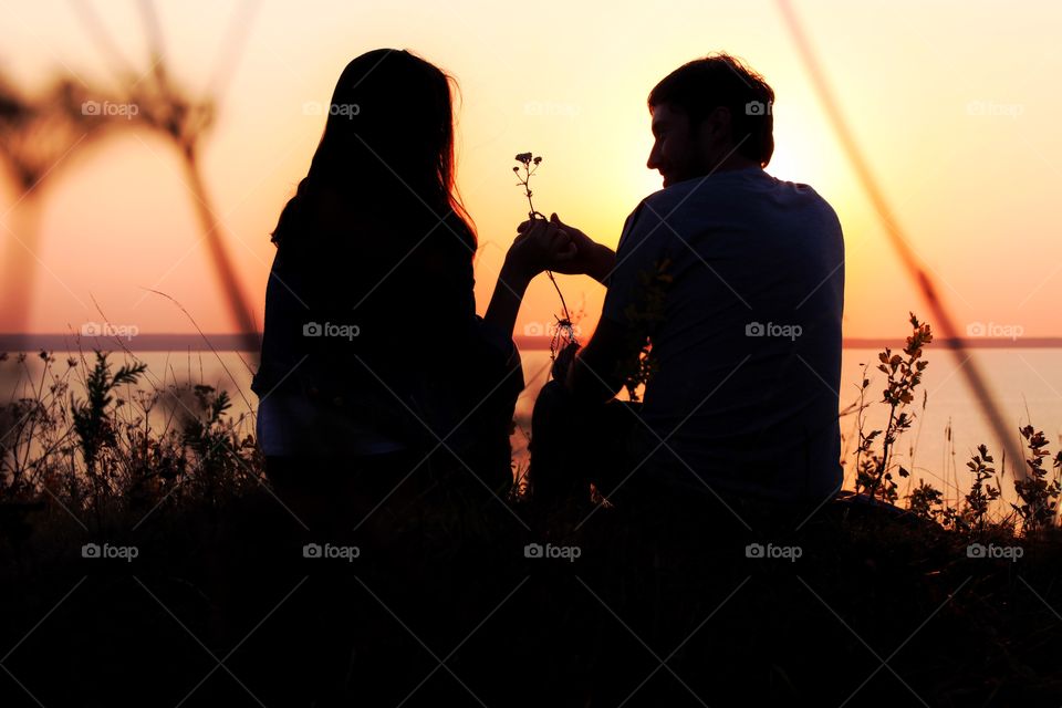 silhouette couple in love on the sunset