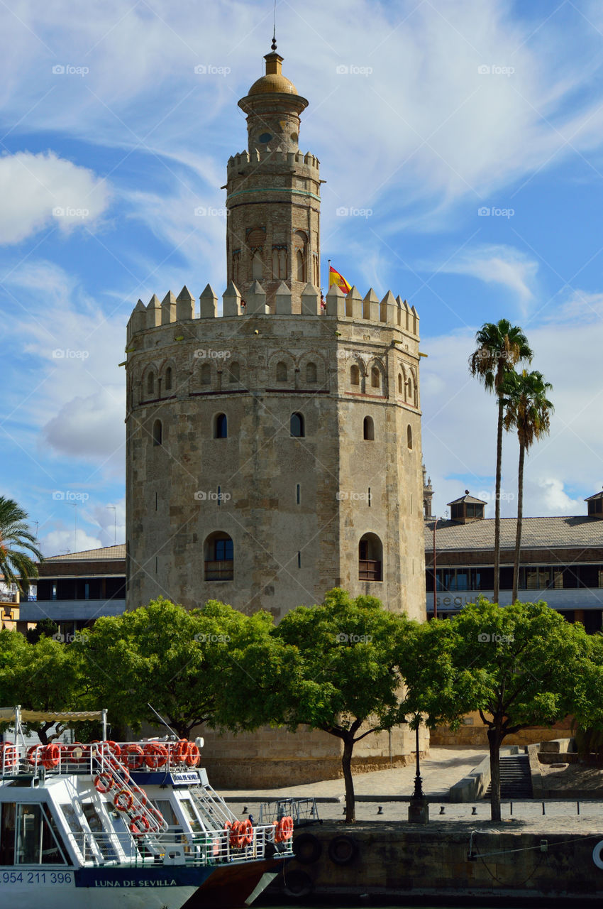 View of Torre del Oro from river Guadalquivir in Sevilla, Spain.