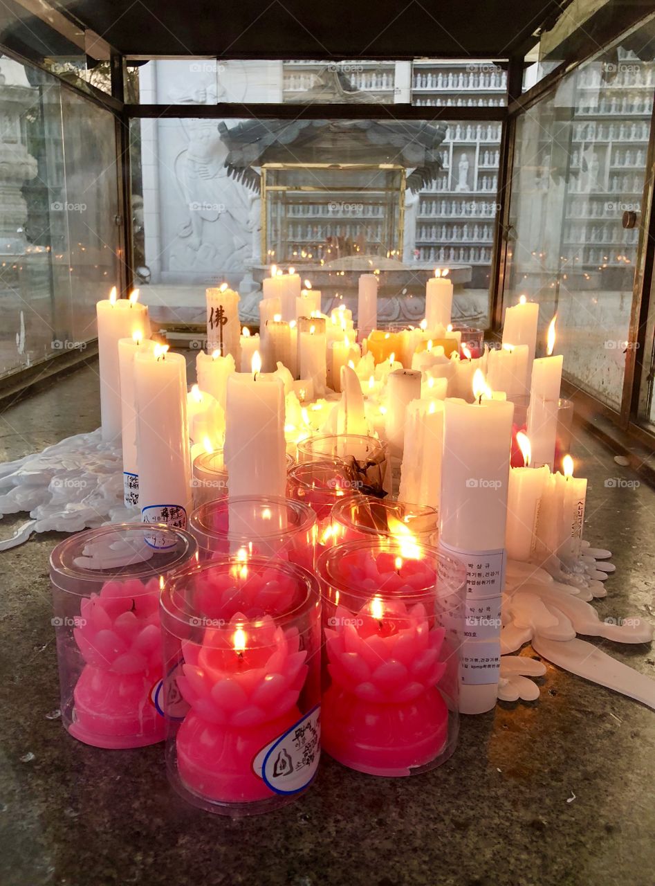 Candles lit, just weeks before the celebrations to ring in the birth of Buddha. The candles are sad, but full of hope and optimism as well. 
