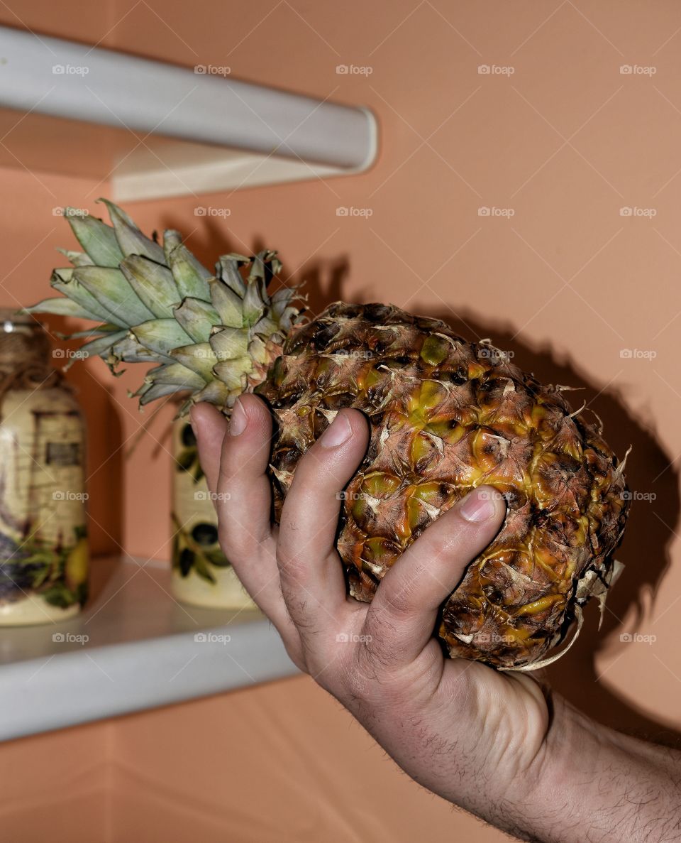 holding pineapple