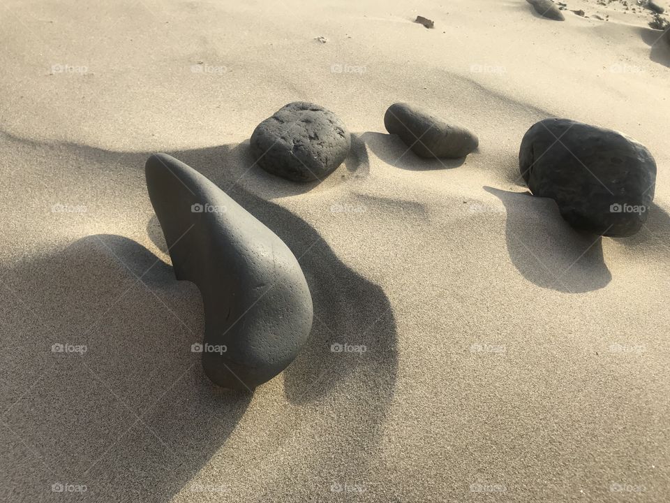 Oregon coast rocks shadow sand