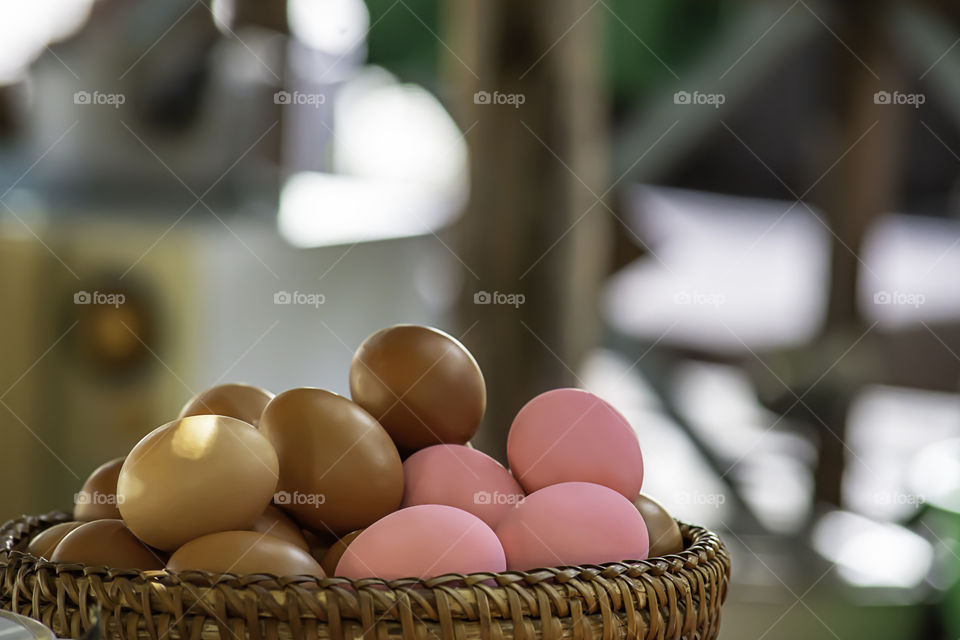 Egg and preserved egg in a wicker basket