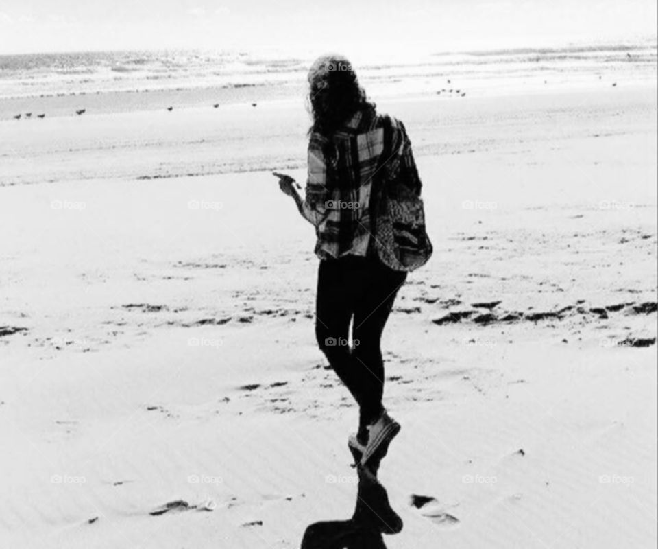 Woman walking in the beach, B&W Photo 