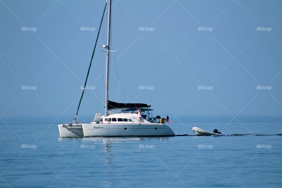 A big, beautiful Catamaran on a beautiful beach day 