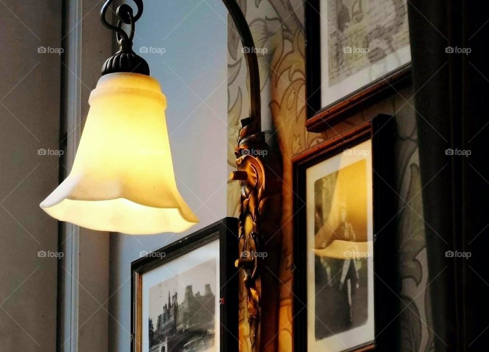 Lamp and pictures on the wall in a café