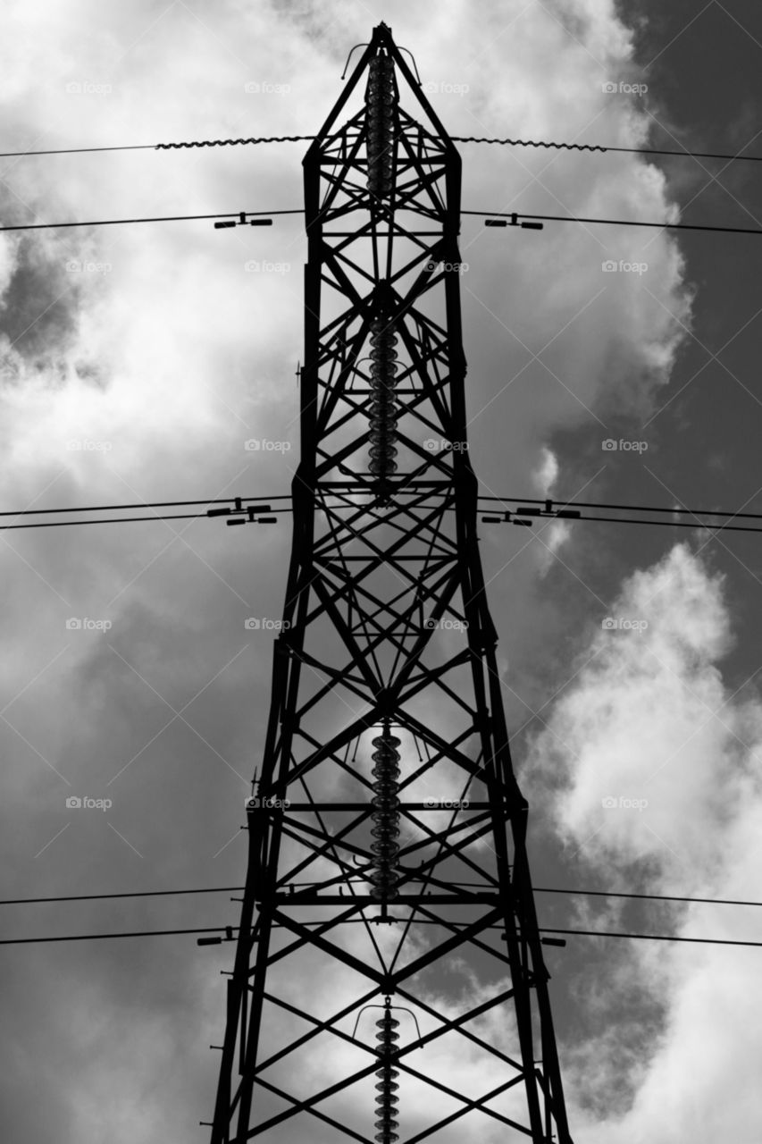 Power. Liked the simple lines and backdrop of this man made structure against the sky and clouds.