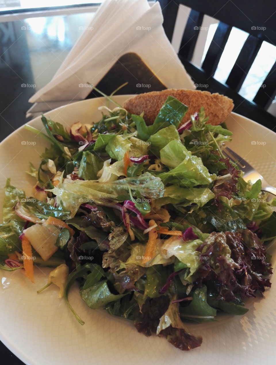 fresh healthy green salad with whol grain bread