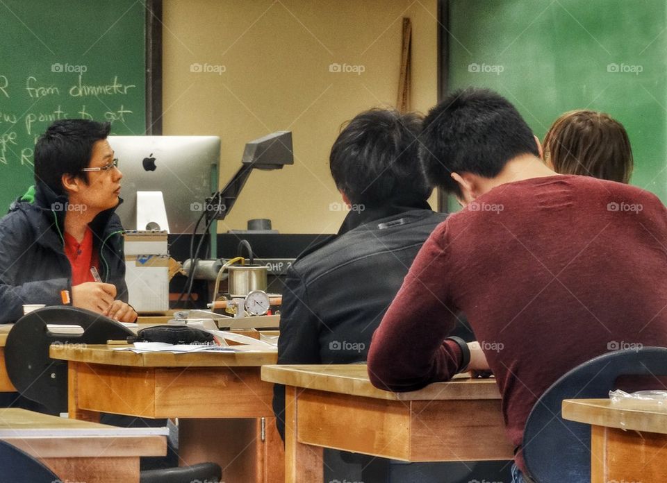 College Students Taking Exam. College Students Taking An Exam
