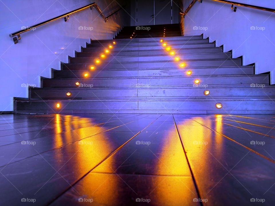 purple stairs with handrails