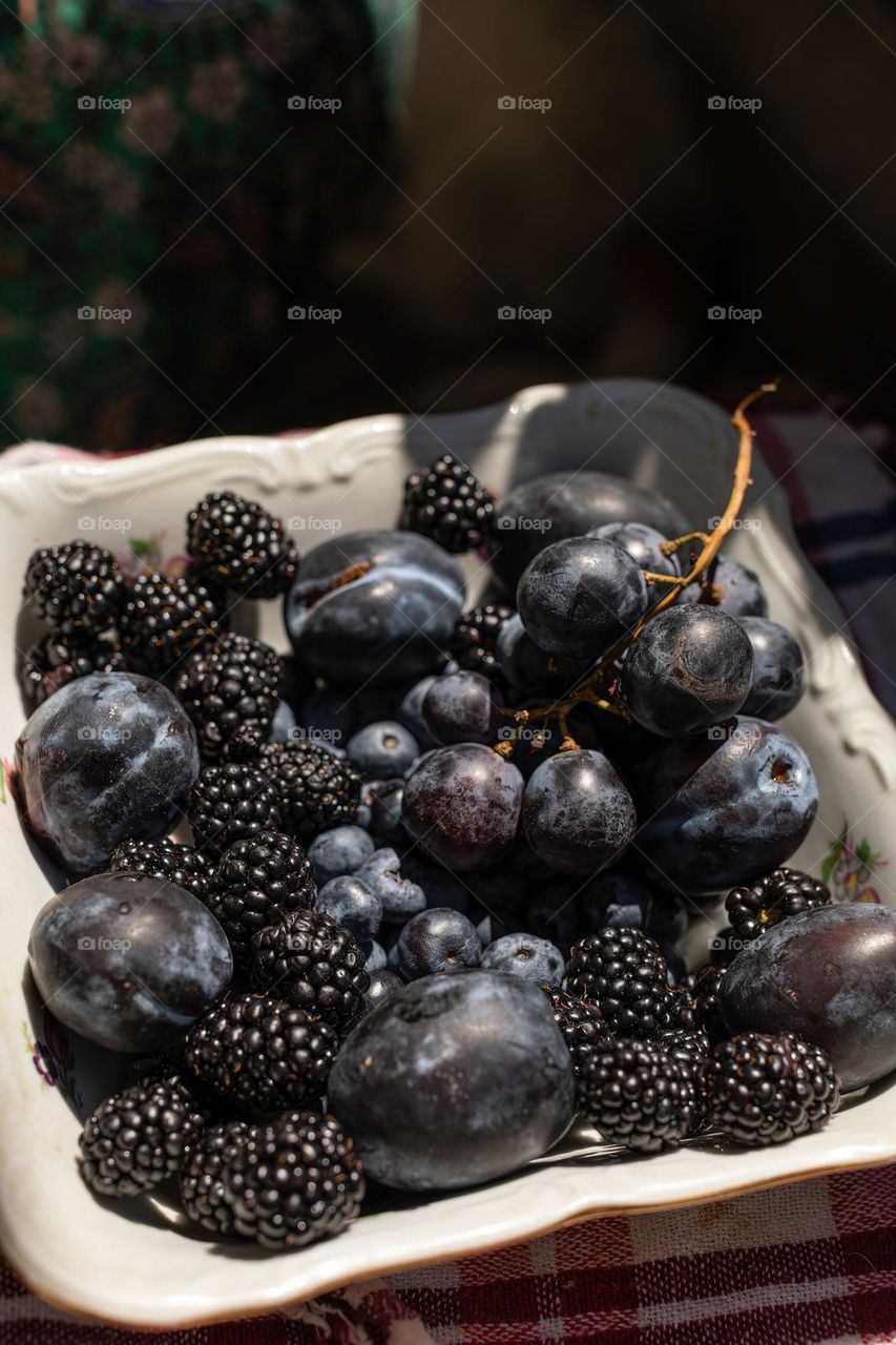 Fruit mix, summer fruit: grapes, blackberries, black currants, plums