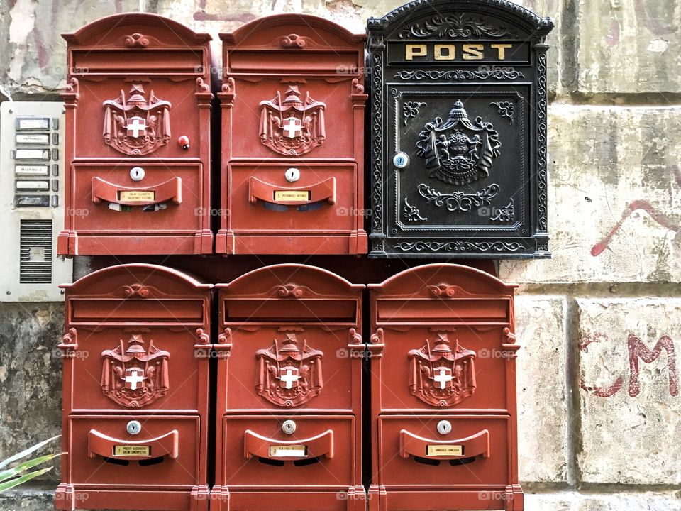 The red and black mailboxes background. Somewhere in Rome. Color love. Colorful background. 