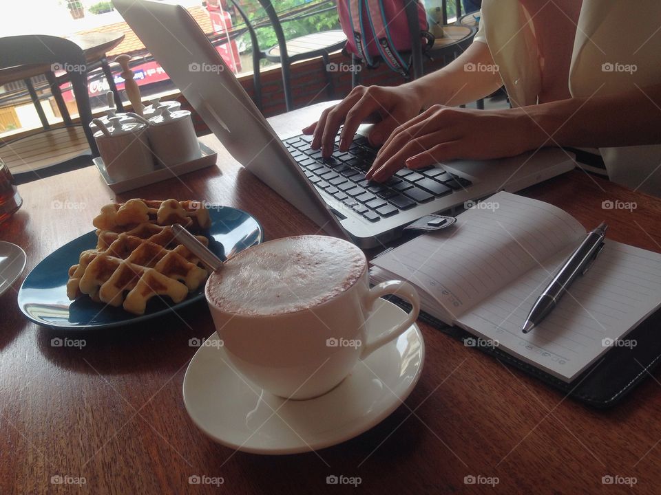 In a coffee shop working