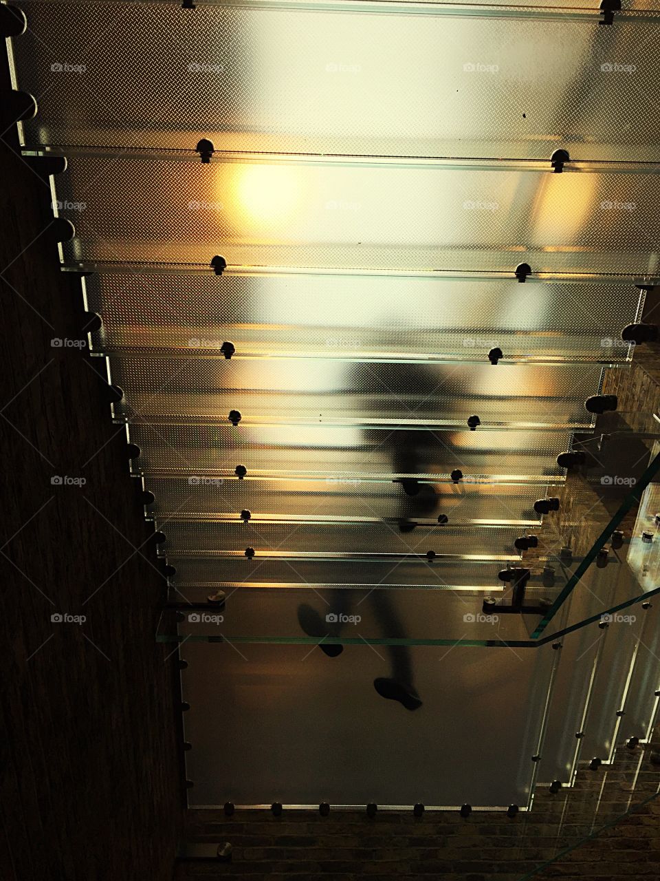 From beneath a staircase!