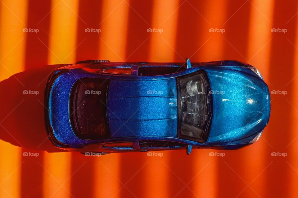 blue car on a orange background